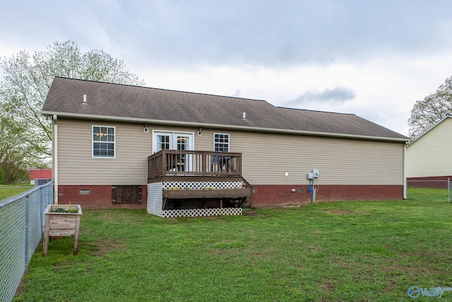 rear view of house with a wooden deck, a fenced backyard, a yard, and crawl space