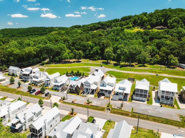 bird's eye view featuring a forest view and a residential view