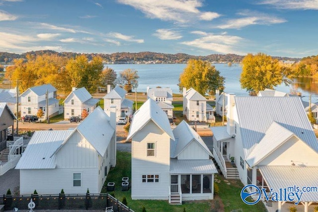 bird's eye view featuring a water view and a residential view