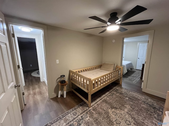 bedroom featuring ceiling fan and dark hardwood / wood-style floors