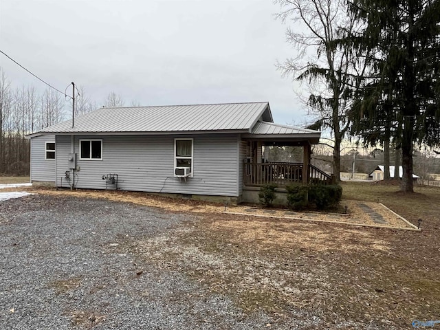 exterior space featuring cooling unit and a porch