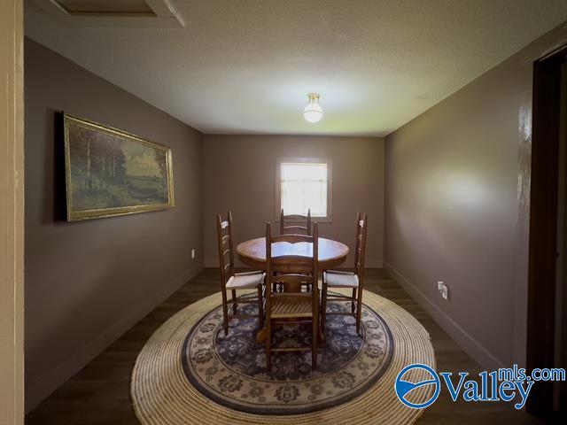 dining area featuring dark hardwood / wood-style floors