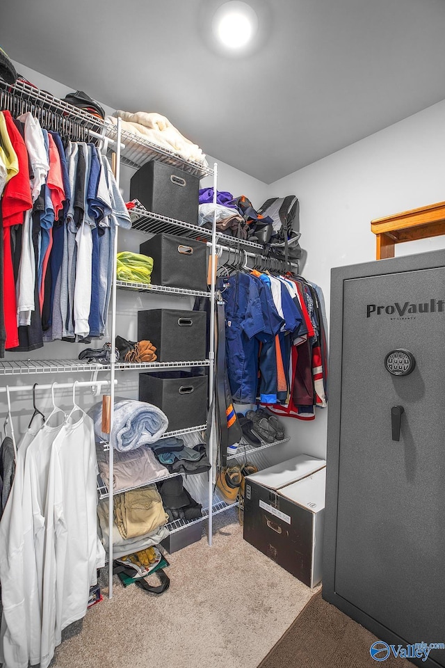 walk in closet with carpet flooring