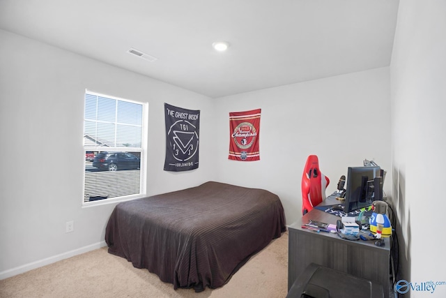 carpeted bedroom featuring baseboards