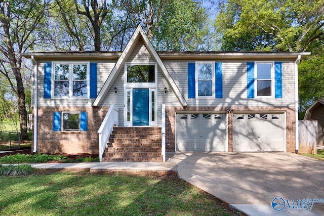 view of front facade with brick siding, an attached garage, and driveway