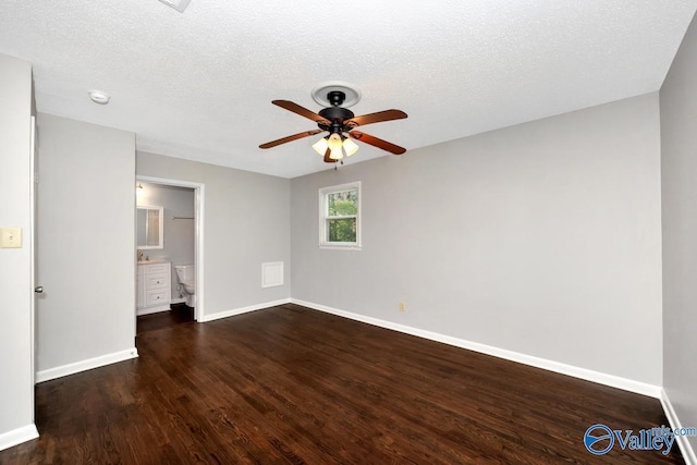 unfurnished room with a textured ceiling, baseboards, a ceiling fan, and wood finished floors