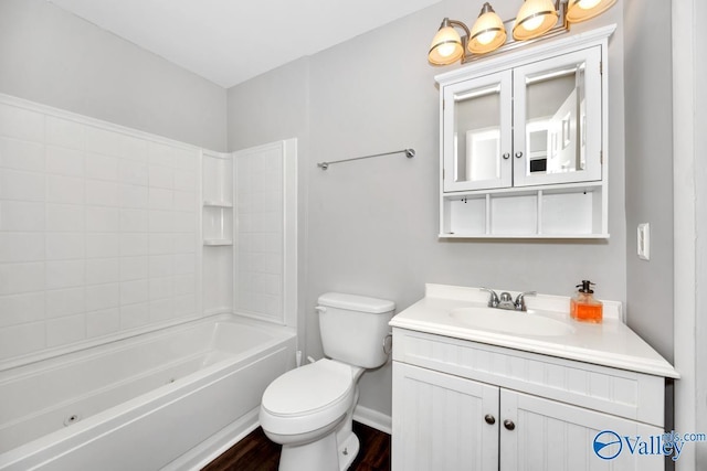 full bath featuring vanity, shower / tub combination, toilet, wood finished floors, and baseboards