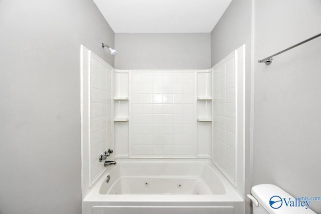 full bathroom featuring a combined bath / shower with jetted tub and toilet