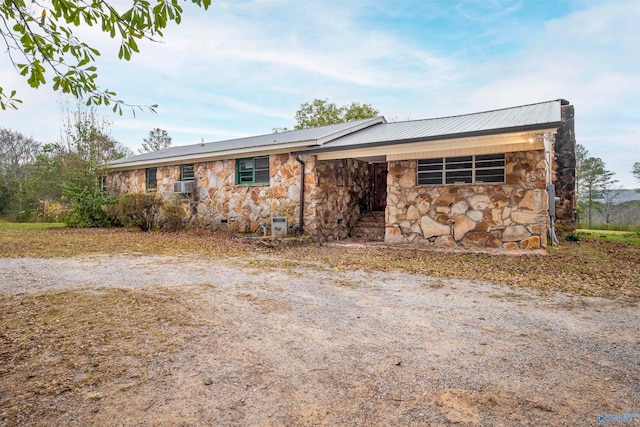 ranch-style house featuring cooling unit