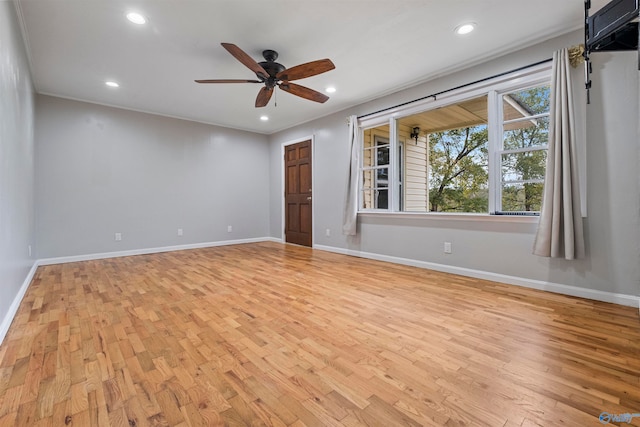 unfurnished room with ceiling fan, crown molding, and light hardwood / wood-style floors