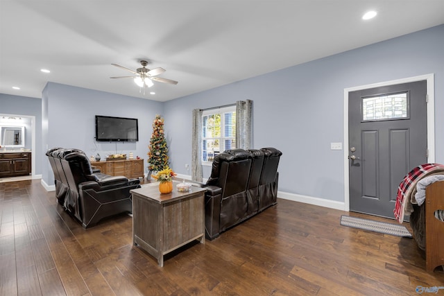 living room featuring dark hardwood / wood-style floors and ceiling fan