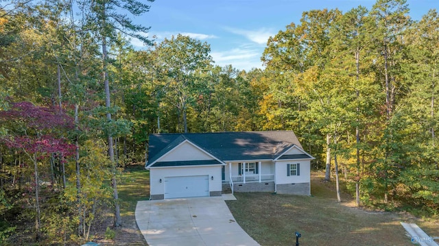 view of front of home with a porch and a garage