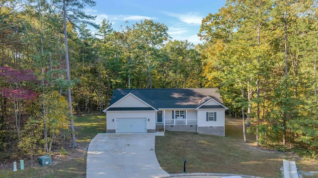 view of front of property featuring a garage and a front lawn