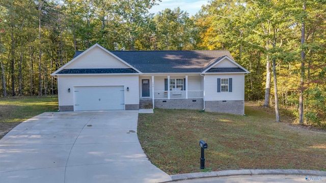 single story home featuring a front lawn, a garage, and covered porch