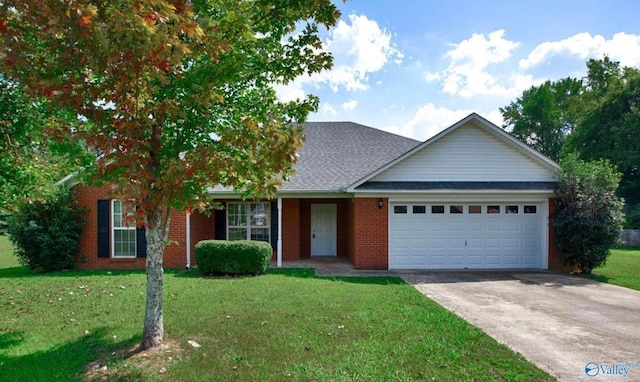 view of front of property featuring a garage and a front yard