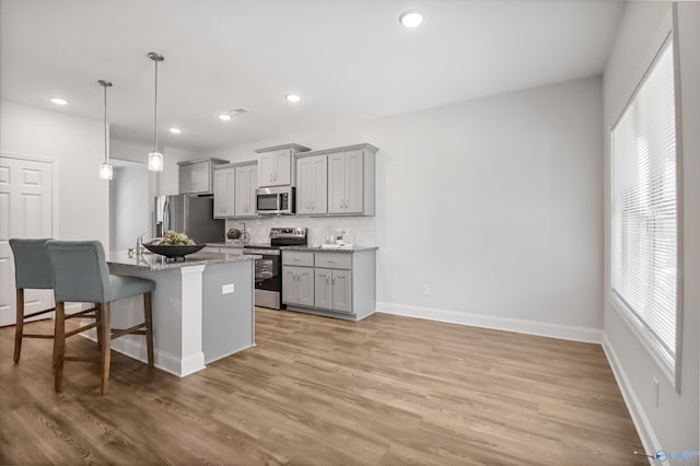 16821 Demi Dr, Athens, AL 35613 - kitchen featuring stainless steel appliances, gray cabinetry, plenty of natural light, and recessed lighting