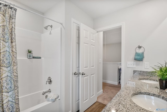 16821 Demi Dr, Athens, AL 35613 - bathroom with shower / tub combo, double vanity, wood finished floors, and baseboards