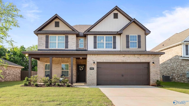 16821 Demi Dr, Athens, AL 35613 - craftsman-style house featuring brick siding, board and batten siding, a front lawn, and concrete driveway