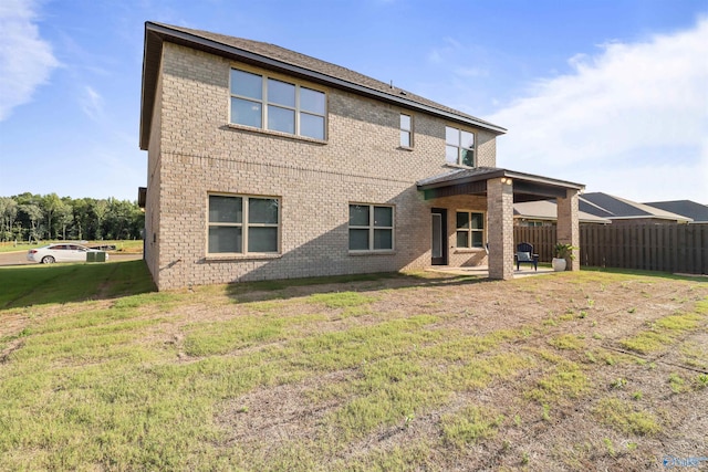 16821 Demi Dr, Athens, AL 35613 - back of house with brick siding and a patio area