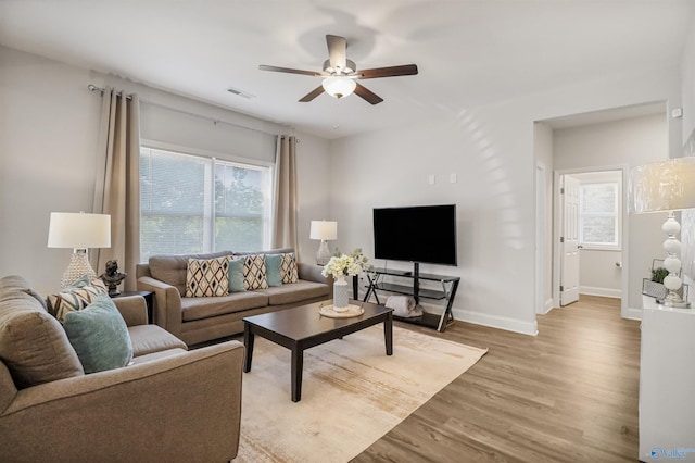 16821 Demi Dr, Athens, AL 35613 - living room with light wood-type flooring, ceiling fan, and baseboards