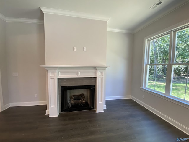 unfurnished living room featuring ornamental molding and dark hardwood / wood-style floors