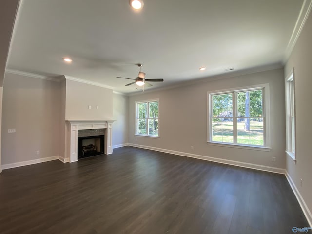 unfurnished living room with crown molding, dark hardwood / wood-style floors, and ceiling fan