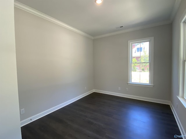 unfurnished room with ornamental molding and dark hardwood / wood-style flooring