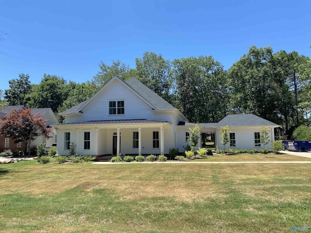 modern inspired farmhouse with a porch and a front yard