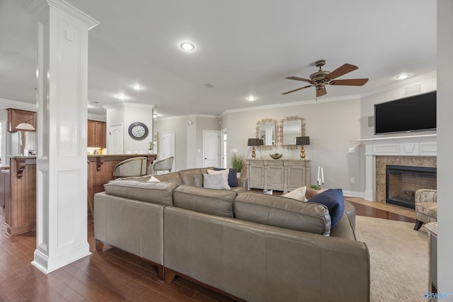 living area featuring dark wood-style floors and crown molding