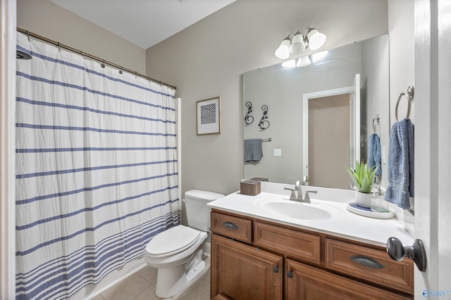 bathroom with tile patterned floors, a shower with curtain, toilet, and vanity