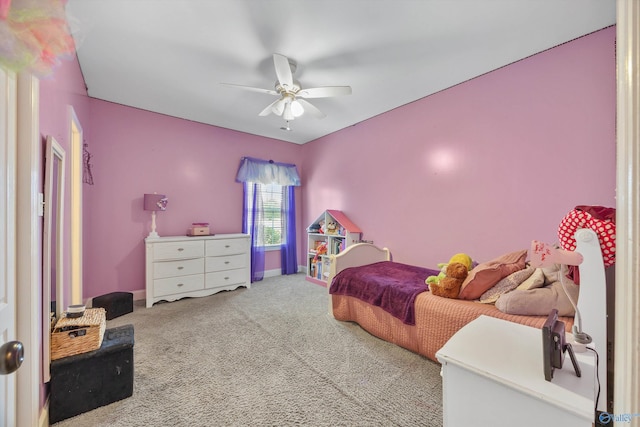 carpeted bedroom with baseboards and a ceiling fan