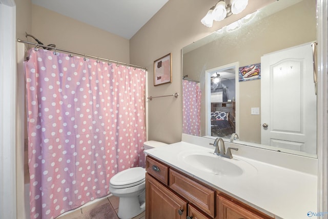 full bathroom featuring a shower with shower curtain, toilet, vanity, and tile patterned flooring