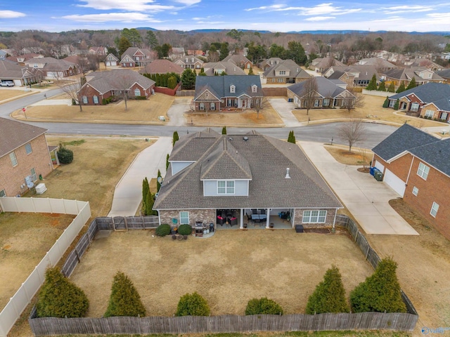 birds eye view of property with a residential view