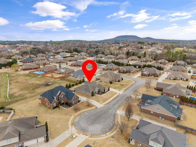 birds eye view of property featuring a mountain view and a residential view