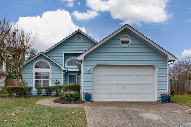 view of front facade featuring a front lawn and a garage