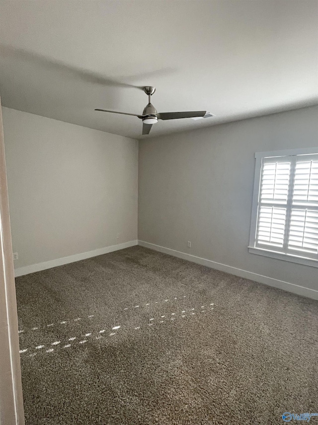 carpeted empty room with ceiling fan