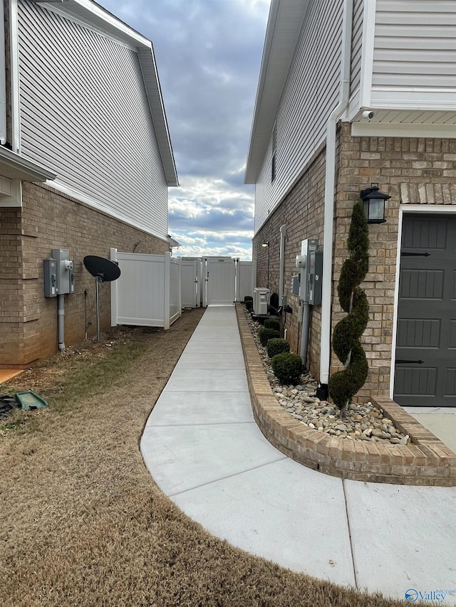 view of home's exterior featuring a garage and central air condition unit