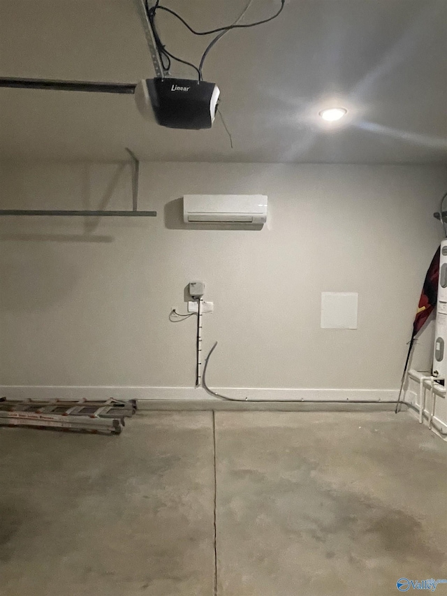 garage featuring a wall mounted air conditioner and a garage door opener