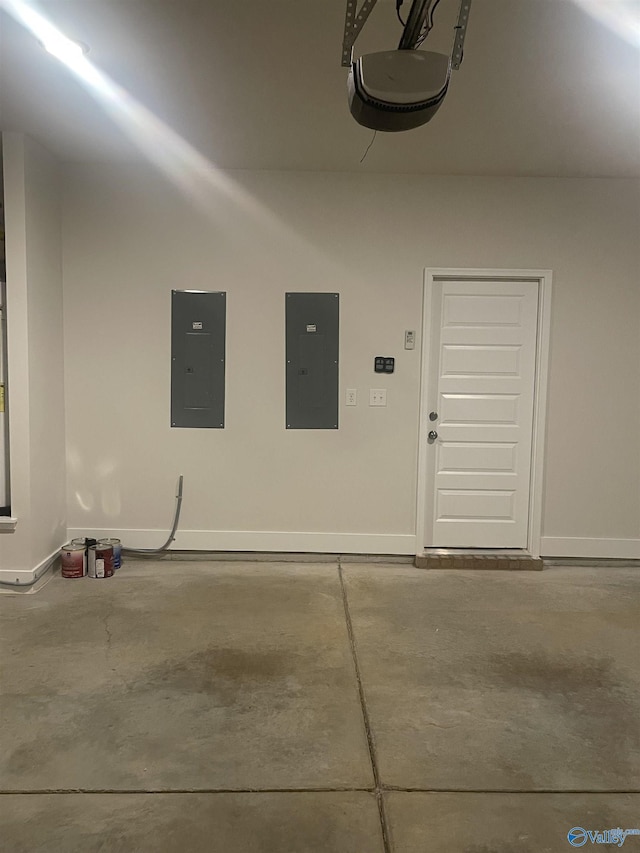 garage with electric panel and a garage door opener