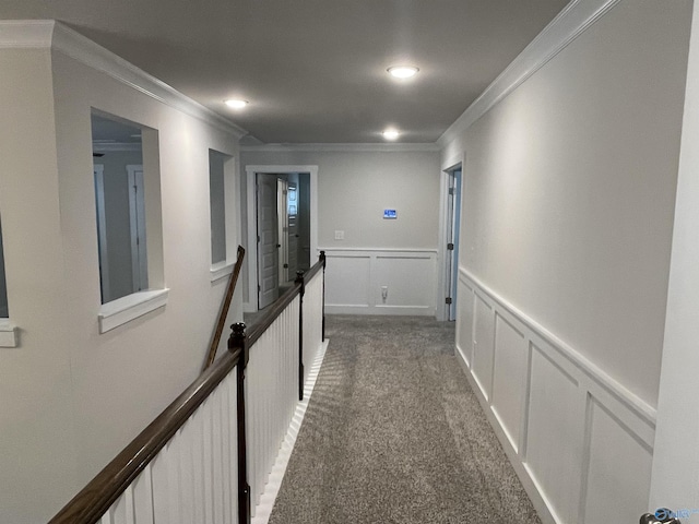 corridor with carpet and crown molding