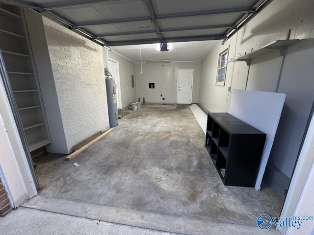 garage featuring water heater and a garage door opener