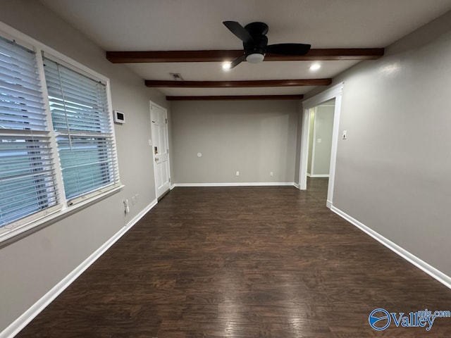 unfurnished room with baseboards, ceiling fan, and beam ceiling