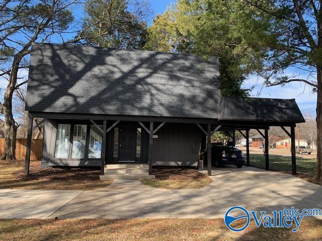 view of front of property with a carport