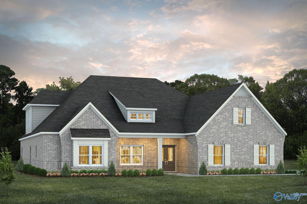 view of front of house with a lawn