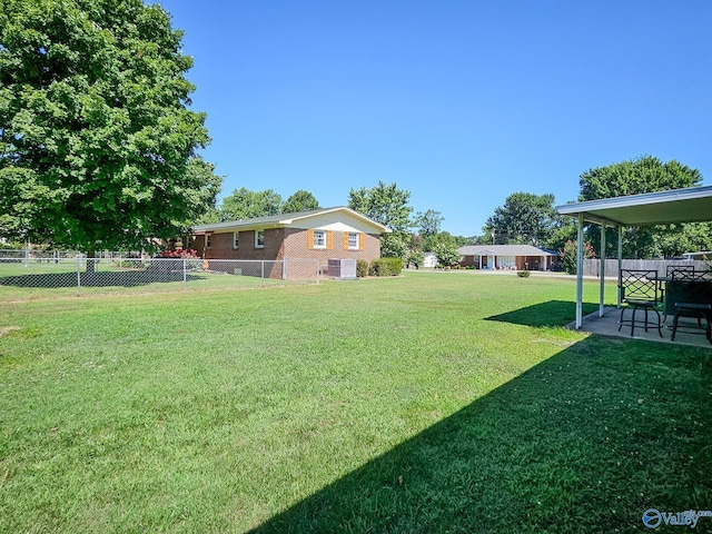 view of yard with a patio area and fence