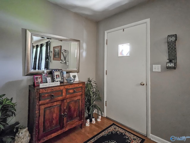 foyer entrance with wood finished floors