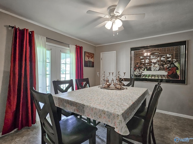 dining room with ceiling fan, crown molding, and baseboards