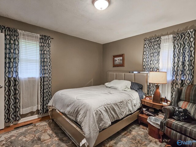 bedroom with wood finished floors