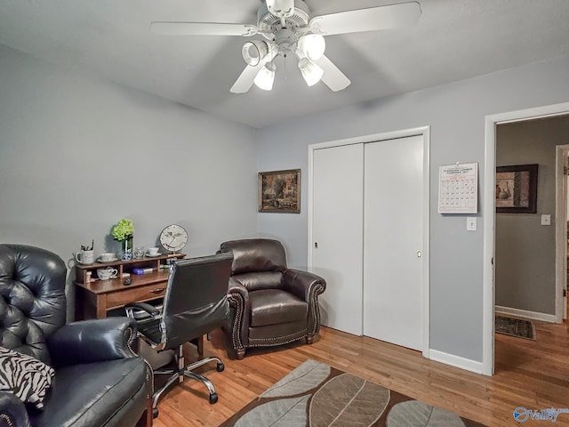 home office featuring visible vents, wood finished floors, baseboards, and ceiling fan