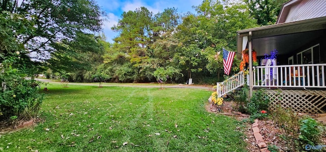 view of yard with a wooden deck